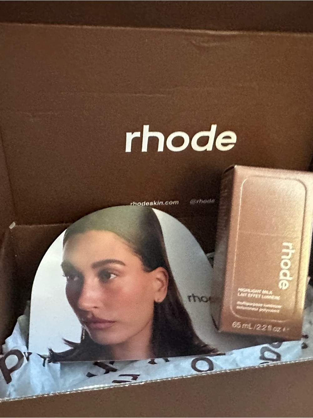 RHODE Highlight Milk in Pearly Rich Bronze 04. Can also be used as a bronzer.